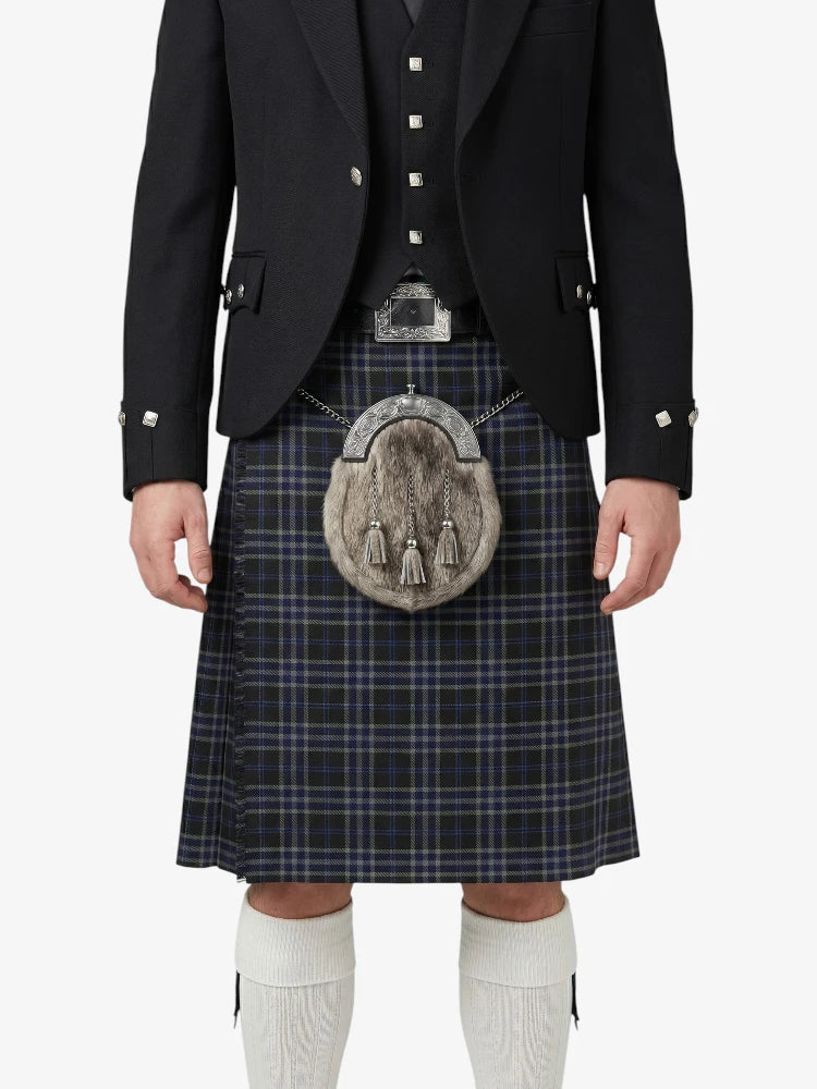 Person wearing a traditional Scottish kilt with a sporran on a white background