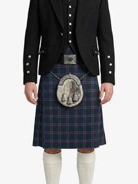 Person wearing a traditional Scottish kilt with a dark jacket on a white background