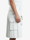 White pleated skirt worn by a person on a white background