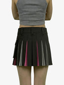 Black pleated skirt with pink accents worn by a person on a white background
