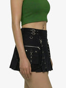 Black skirt with silver buckles and zippers worn by a person on a white background