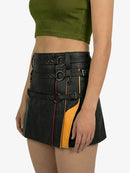 Black leather skirt with yellow accents worn by a person on a white background