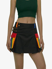 Black skirt with colorful accents worn by a model on a white background