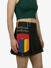 Person wearing a black skirt with rainbow pocket on a white background
