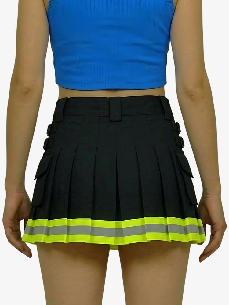 Black pleated skirt with reflective yellow strip worn by a person on a white background