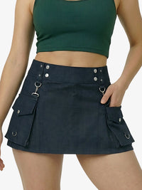 Person wearing a green crop top and black skirt with pocket details on a white background
