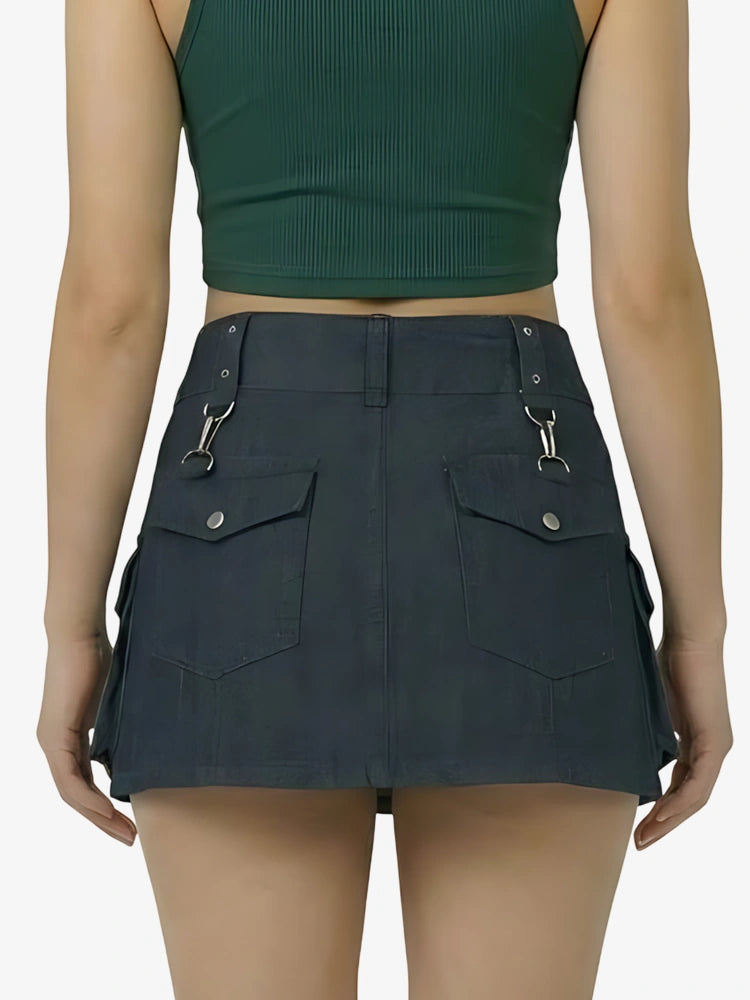 Person wearing a dark green crop top and black skirt on a white background