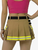 Person wearing a pink crop top and beige skirt with reflective yellow stripes on a white background