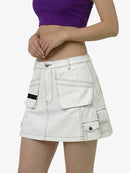 White cargo skirt worn by a person on a white background