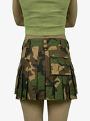Camouflage skirt worn by a person on a white background