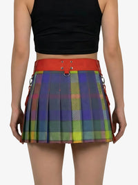 Person wearing a colorful plaid skirt with a red waistband on a white background