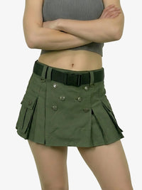 Person wearing a green skirt with a belt on a white background