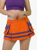 Person wearing an orange skirt with purple accents on a white background