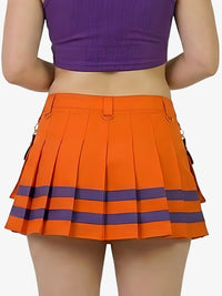 Person wearing an orange pleated skirt with purple accents on a white background