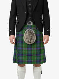 Person wearing a traditional Scottish kilt with a jacket on a white background