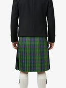 Person wearing a black jacket and green plaid kilt on a white background