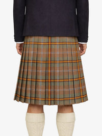 Plaid kilt worn by a person on a white background